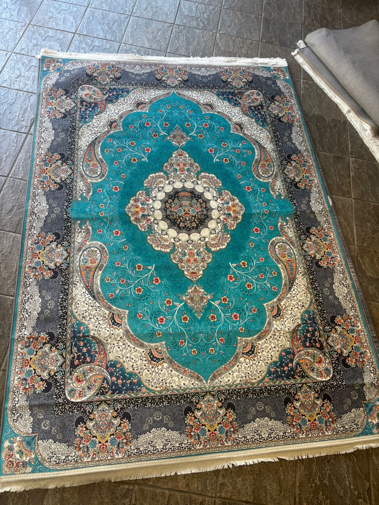 Turquoise floral prayer rug from current stock